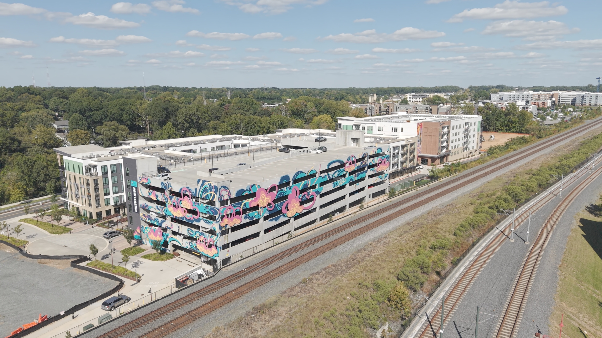 Mural facade and rail corridor · October 6, 2026