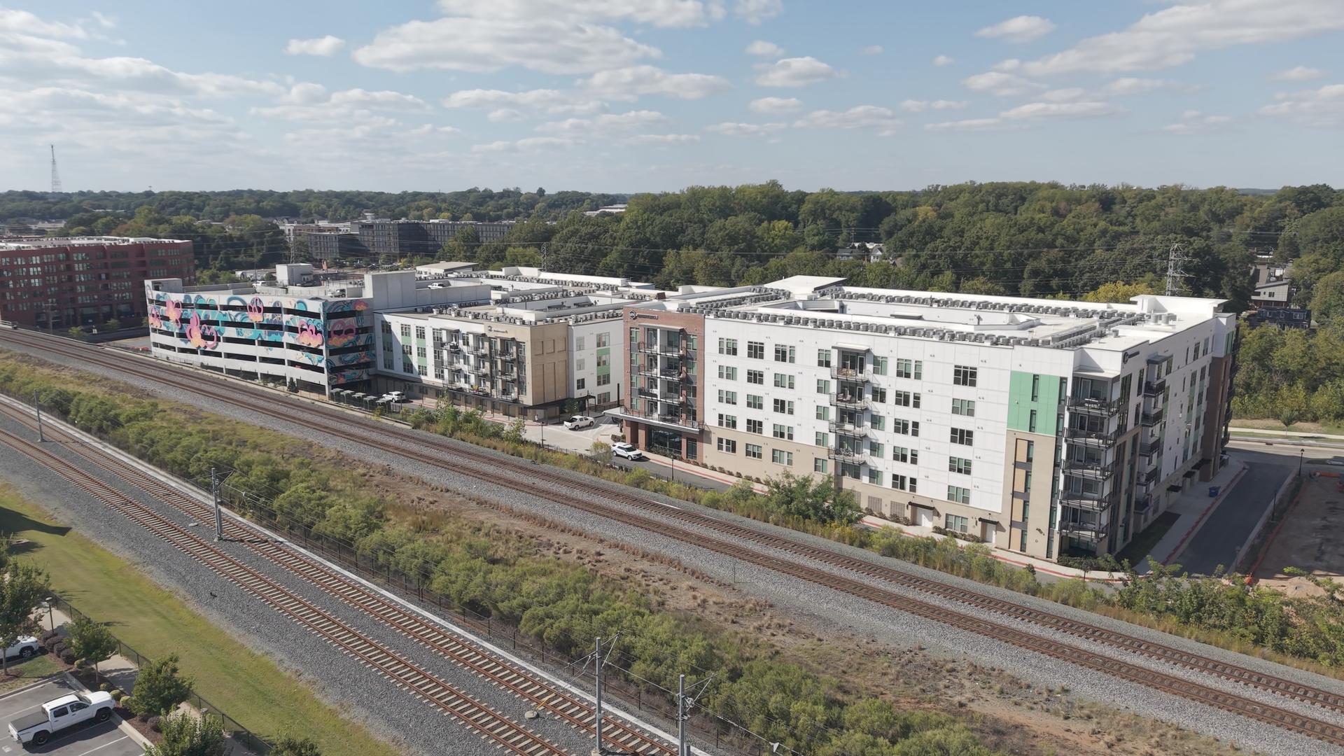 Full complex beside the rail corridor · October 6, 2026