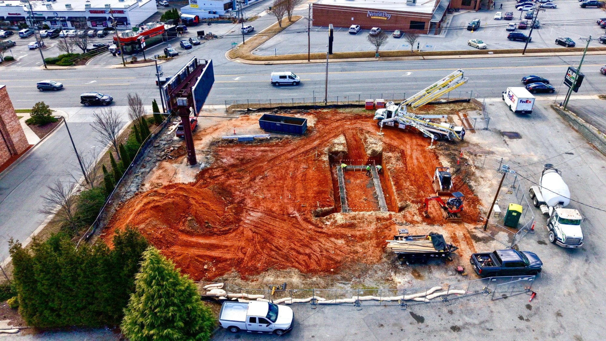 7 Brew Greensboro foundation excavation, late March 2026