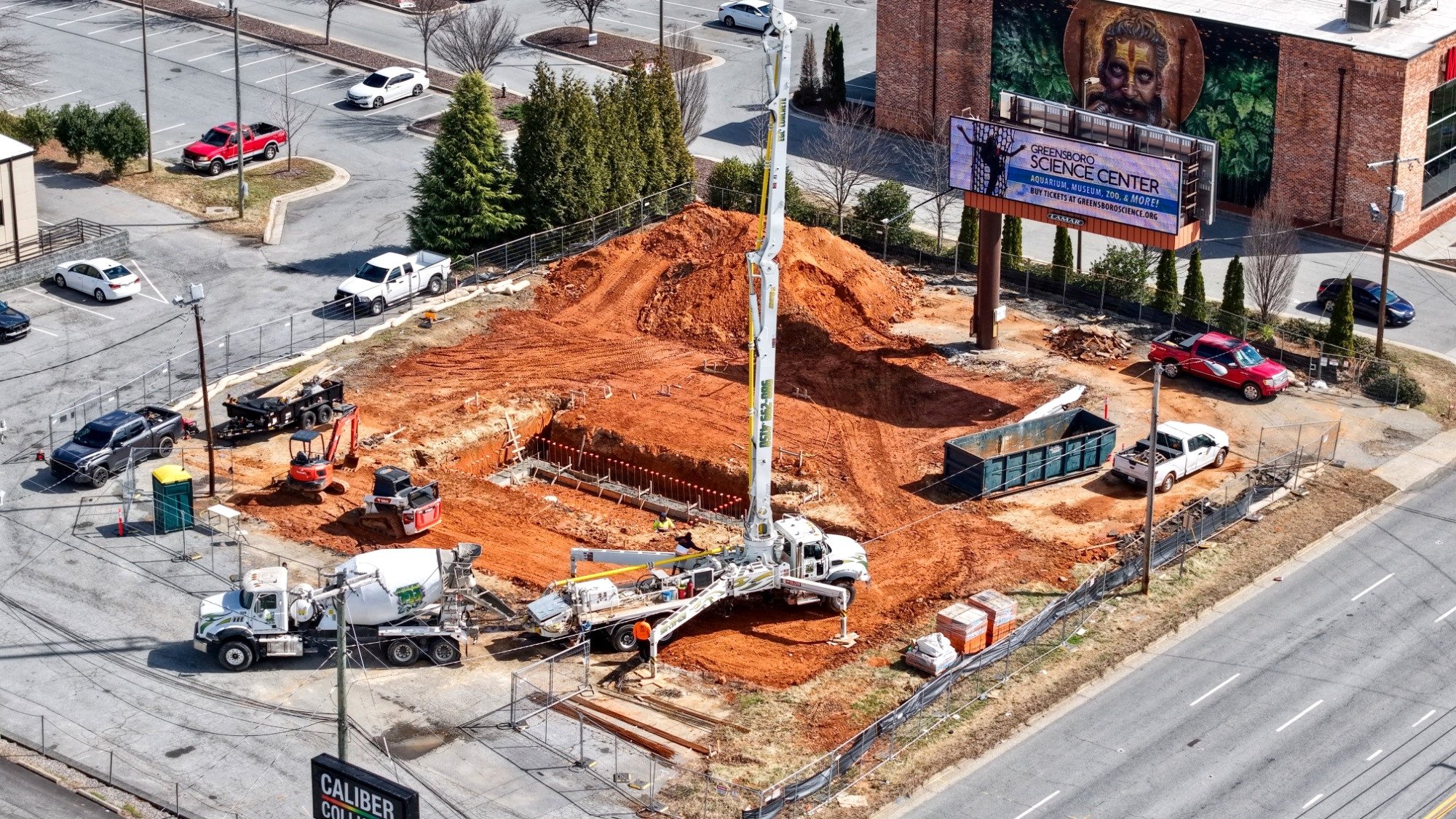 7 Brew Greensboro foundation excavation, late March 2026
