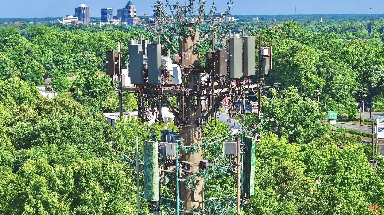 Close aerial documentation of antenna equipment on a Greensboro cell tower