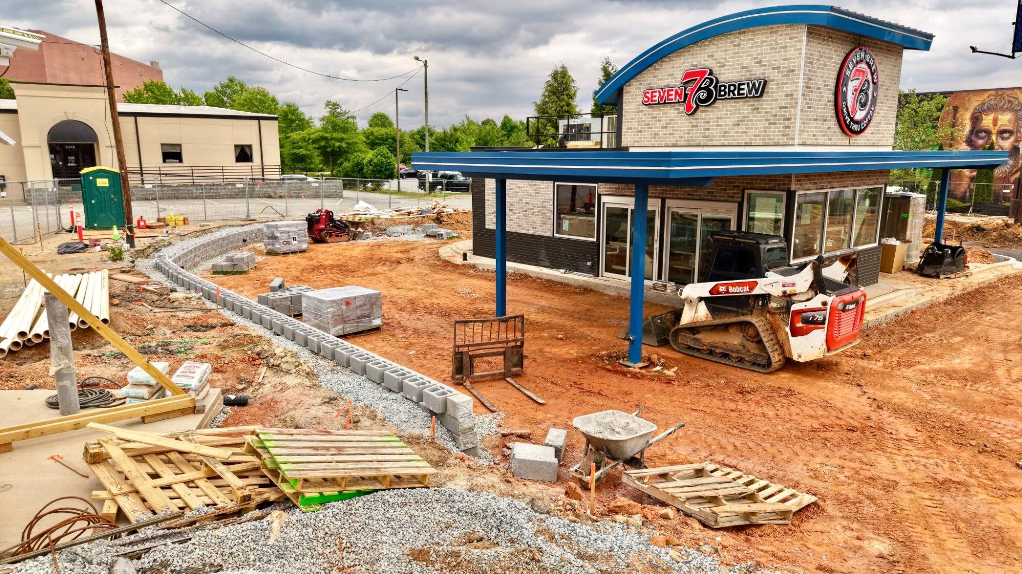 7 Brew Greensboro retaining wall aerial, May 9 2026